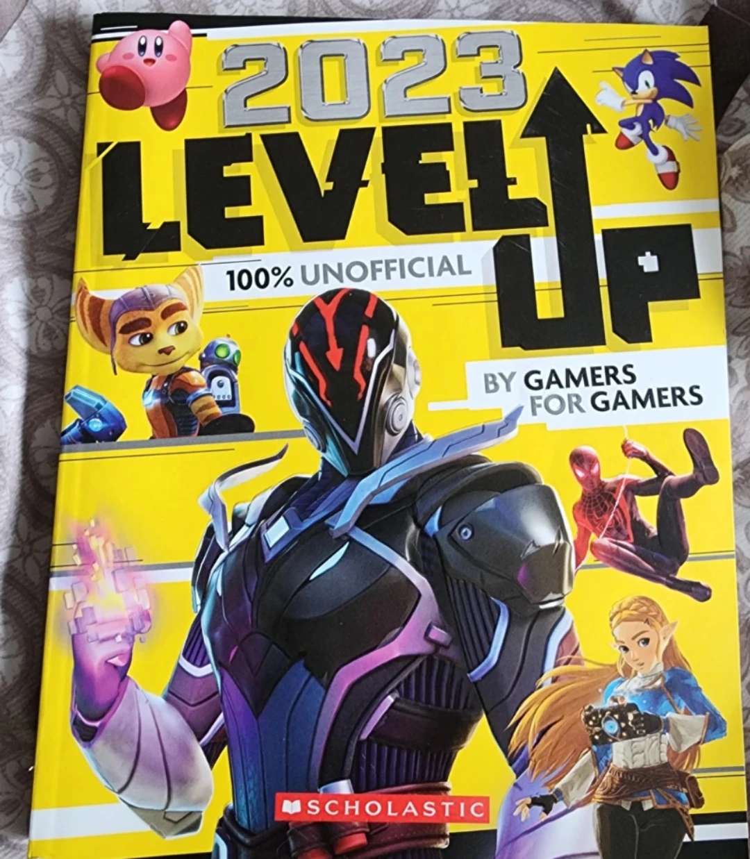 paperback book Level Up 2023: An AFK Book by Scholastic. 