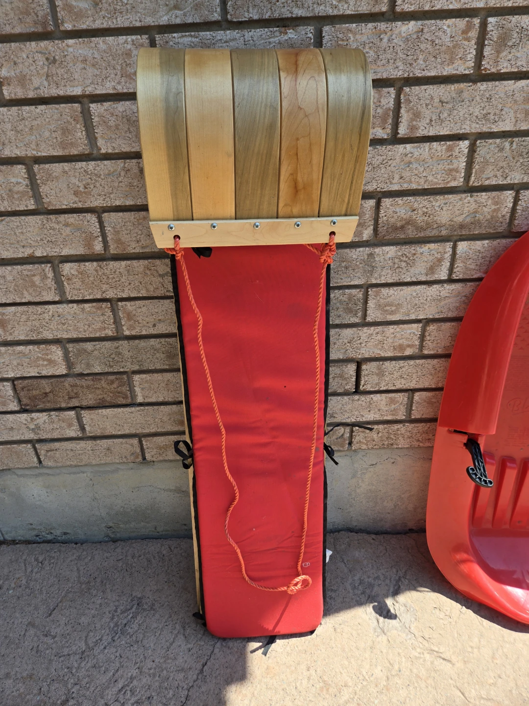 Wooden Toboggan Sled with Red Padded Seat