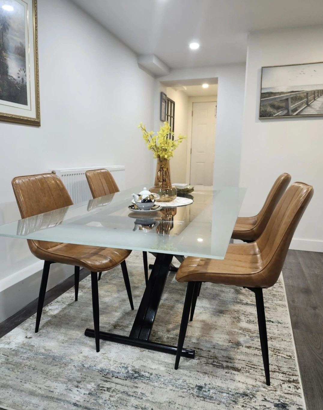 Glass Top Dining Table with 4 Brown Faux Leather Chairs