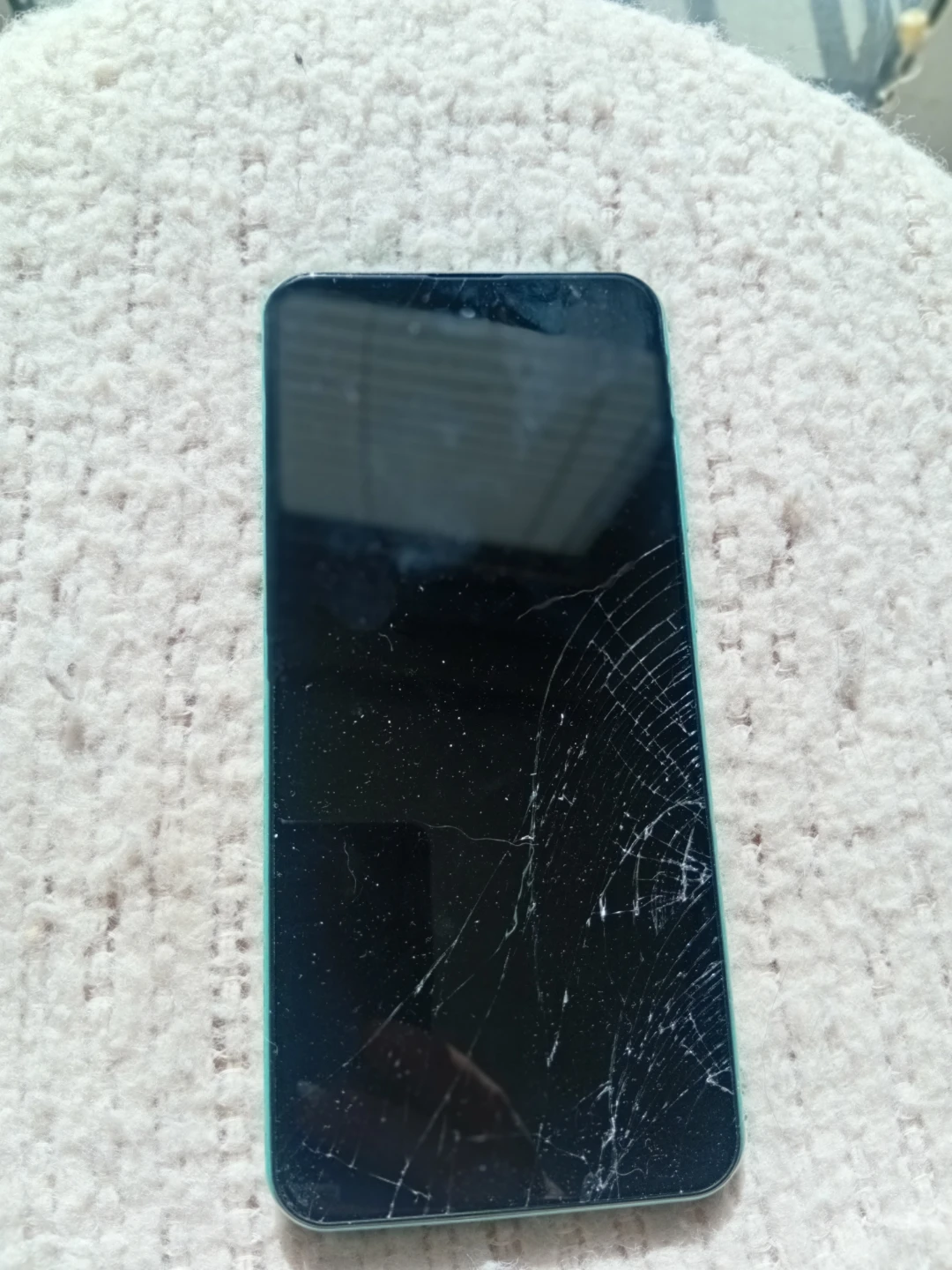 Green Smartphone with Cracked Screen