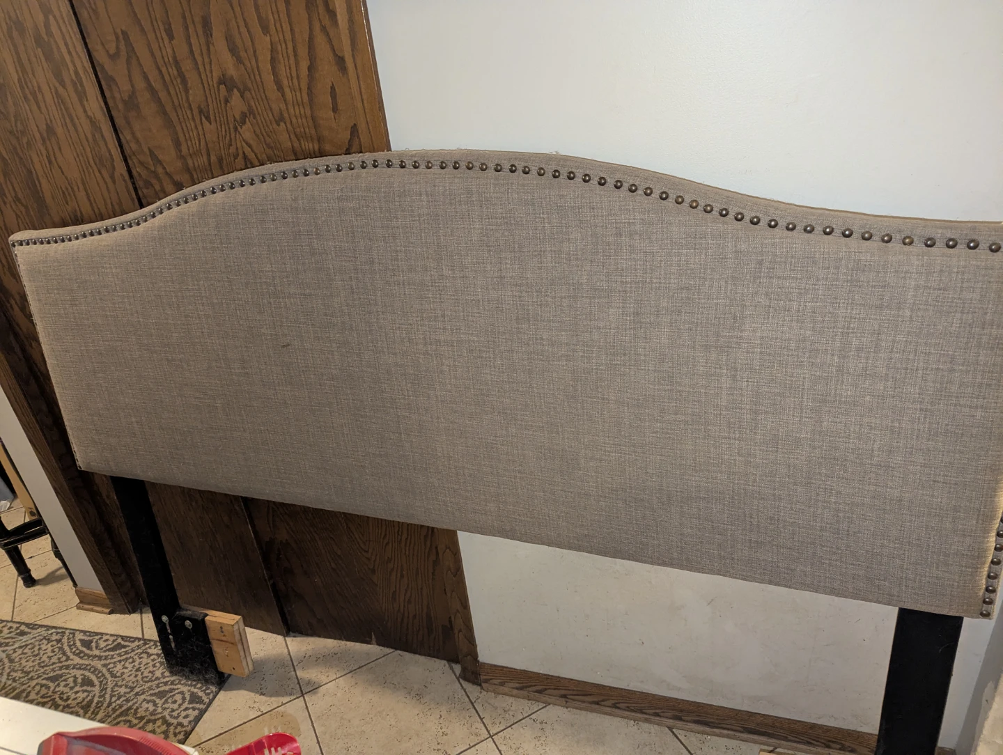 Grey Upholstered Headboard with Nailhead Trim