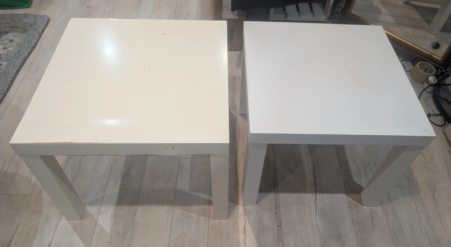 Two white square side/coffee tables