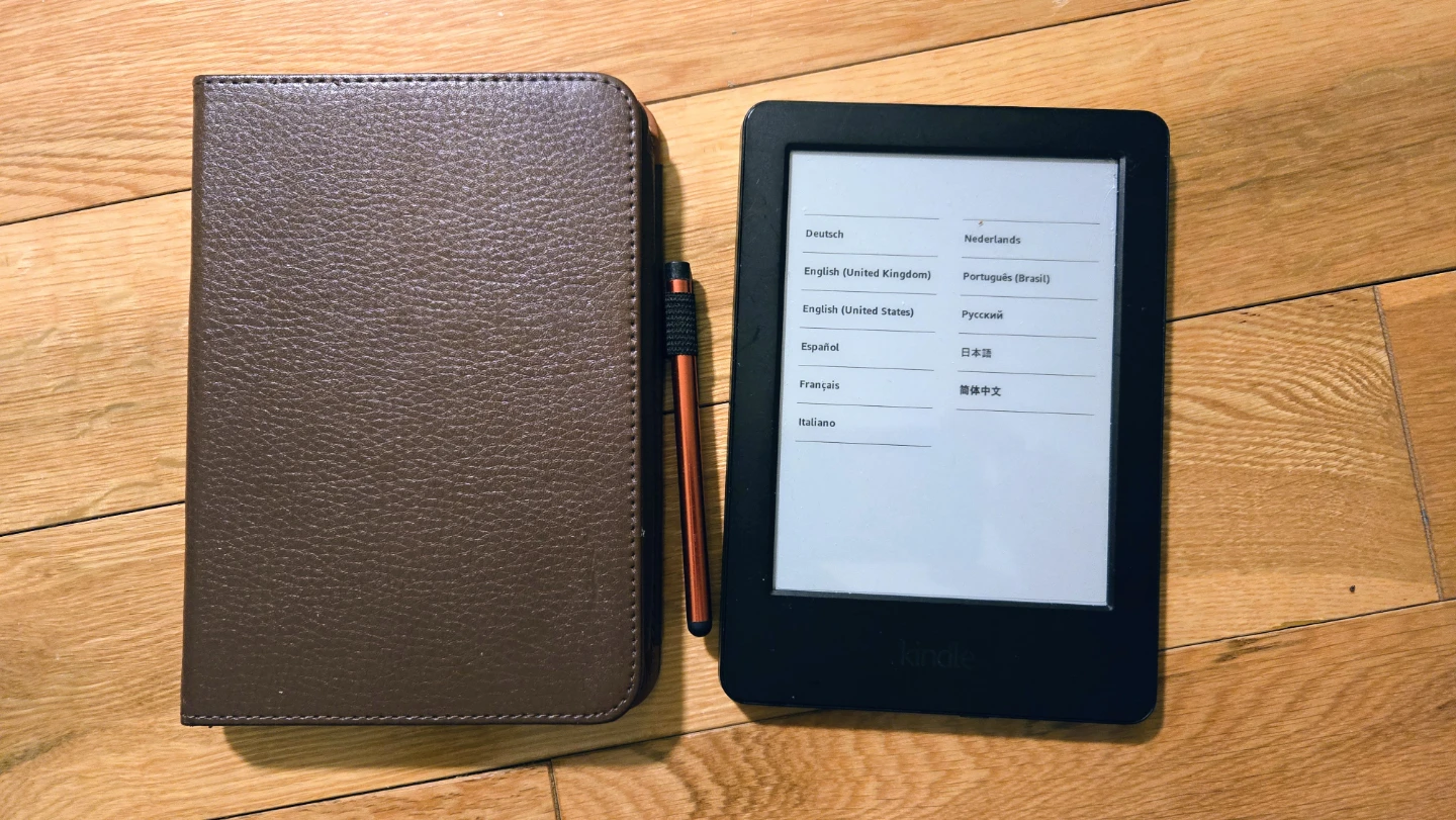 Amazon Kindle E-reader with Brown Case
