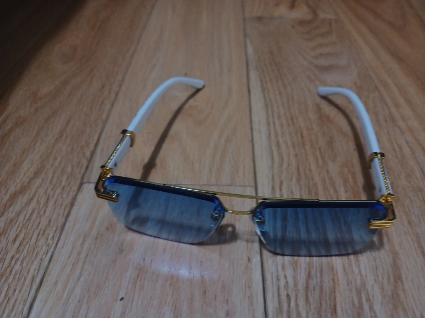 Blue Rimless Sunglasses with Gold and White Accents