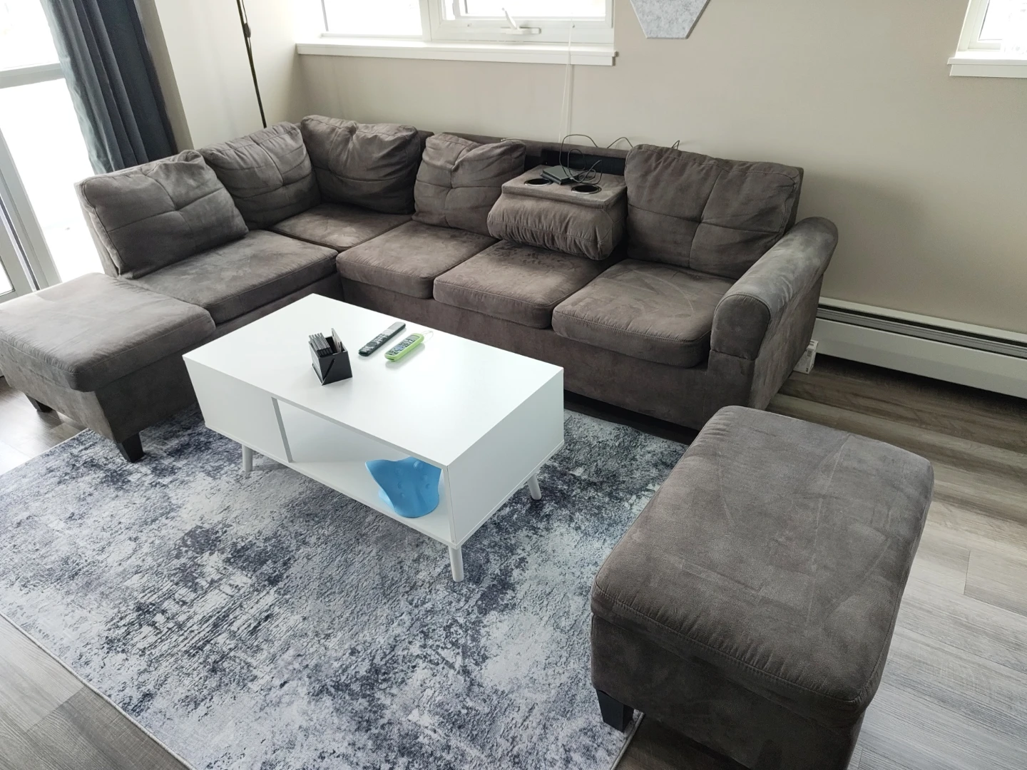 Grey sectional couch with ottoman