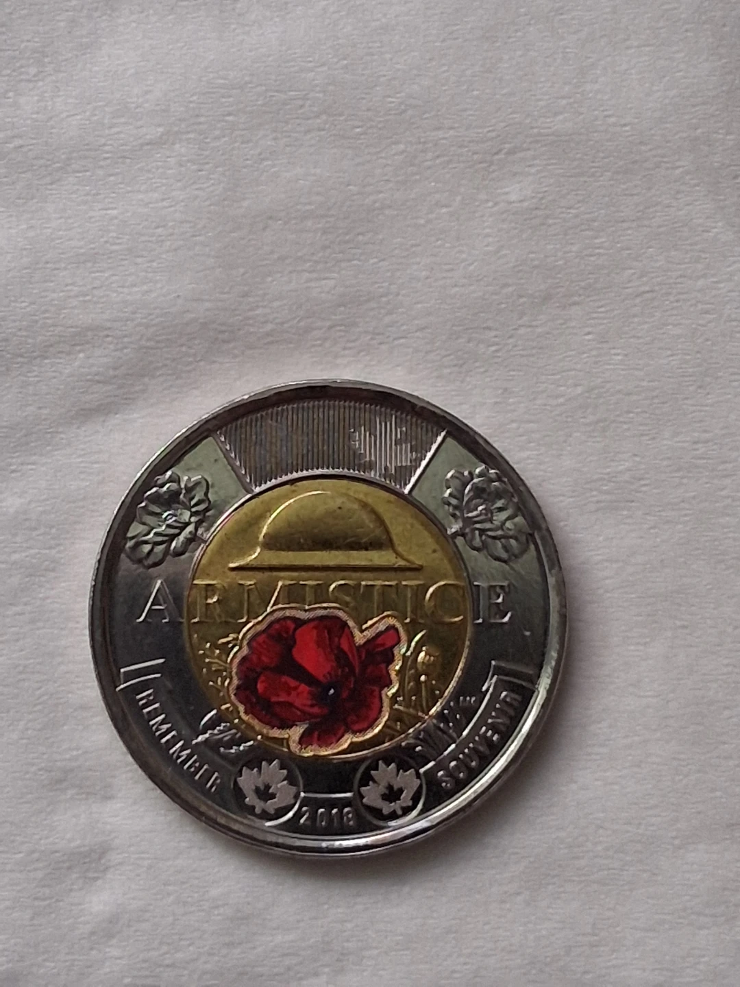 2018 Canadian Armistice $2 coin with a colored poppy