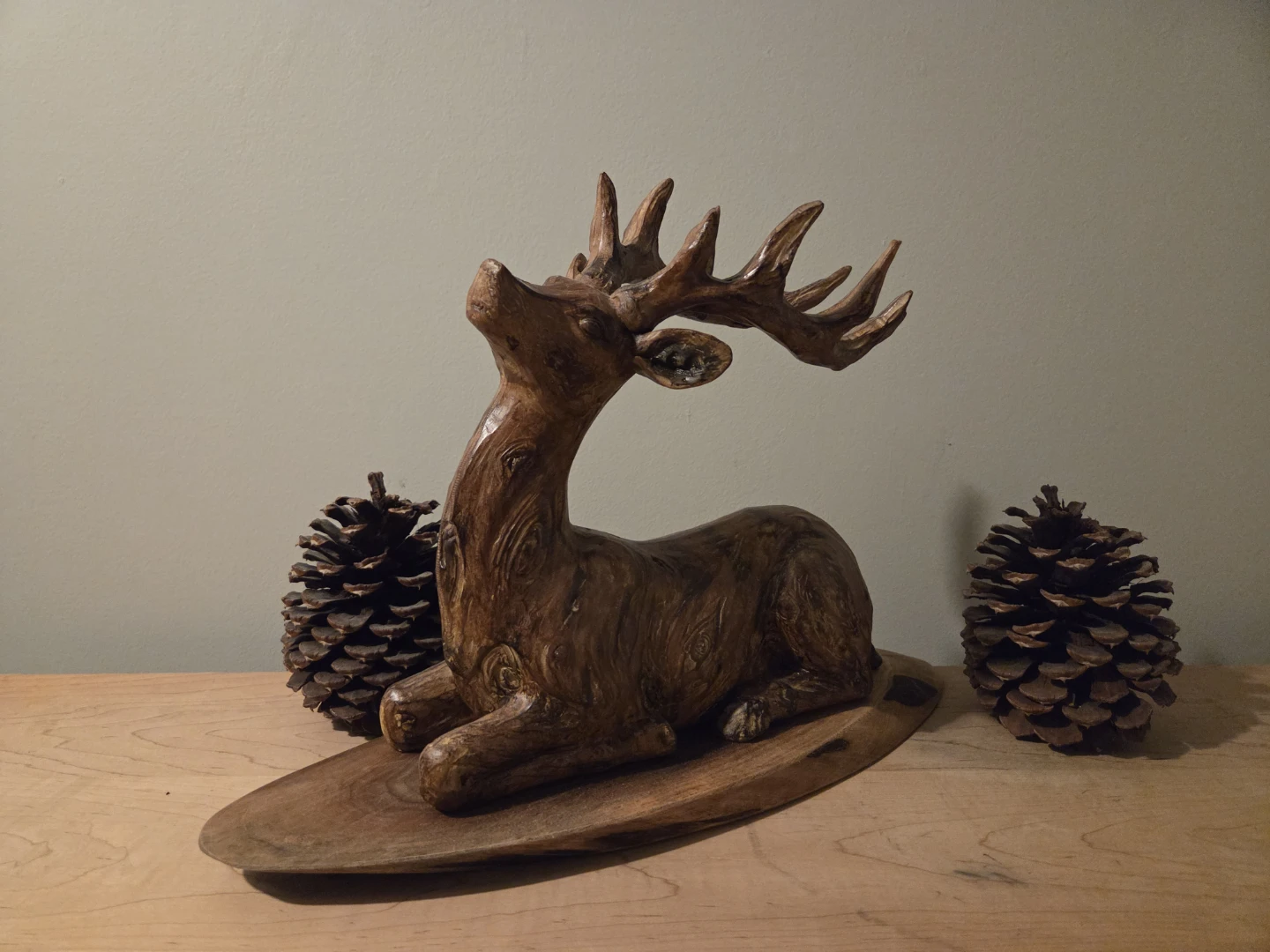 Wooden Deer Sculpture with Pinecones