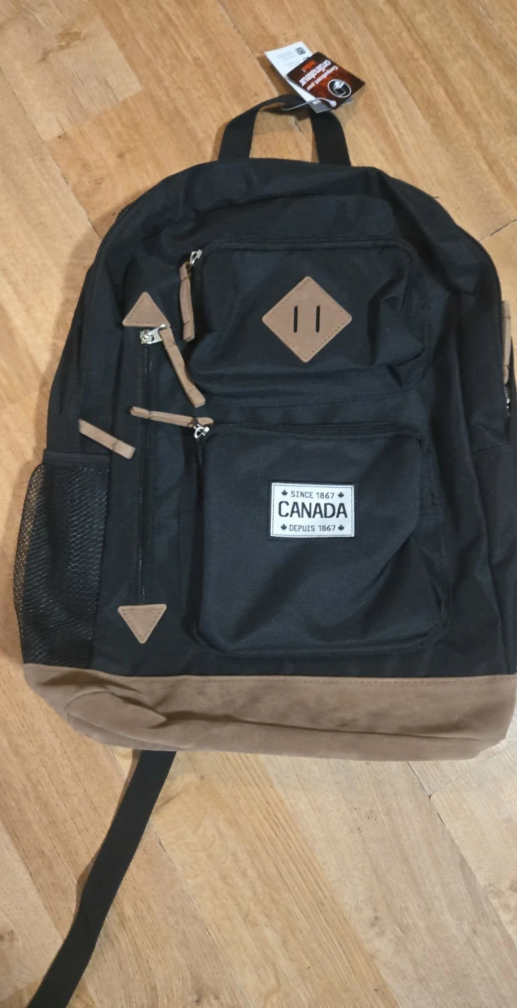 Black Backpack with Canada Design laptop compartment. Brand new