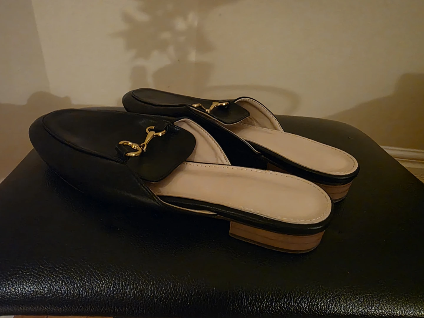 Black Leather Mules with Gold Horsebit Detail