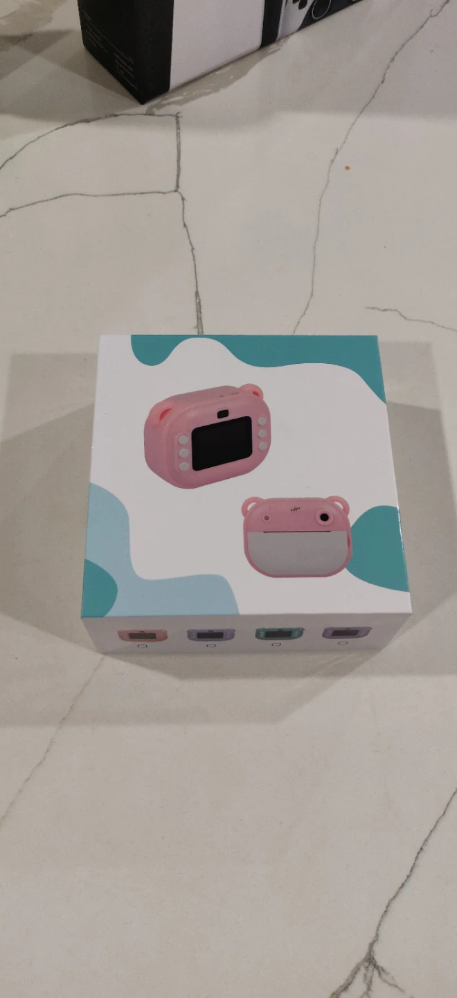 The pink bear-shaped instant print digital  camera