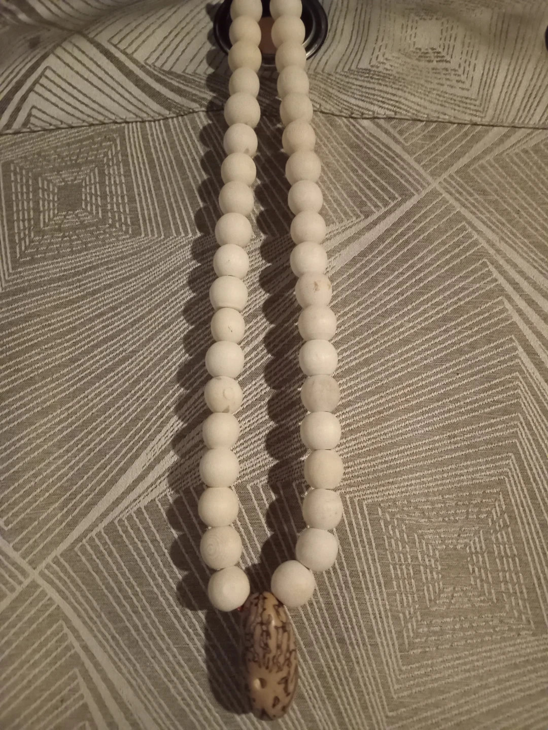 Thousand eyes seed necklace for men or women.