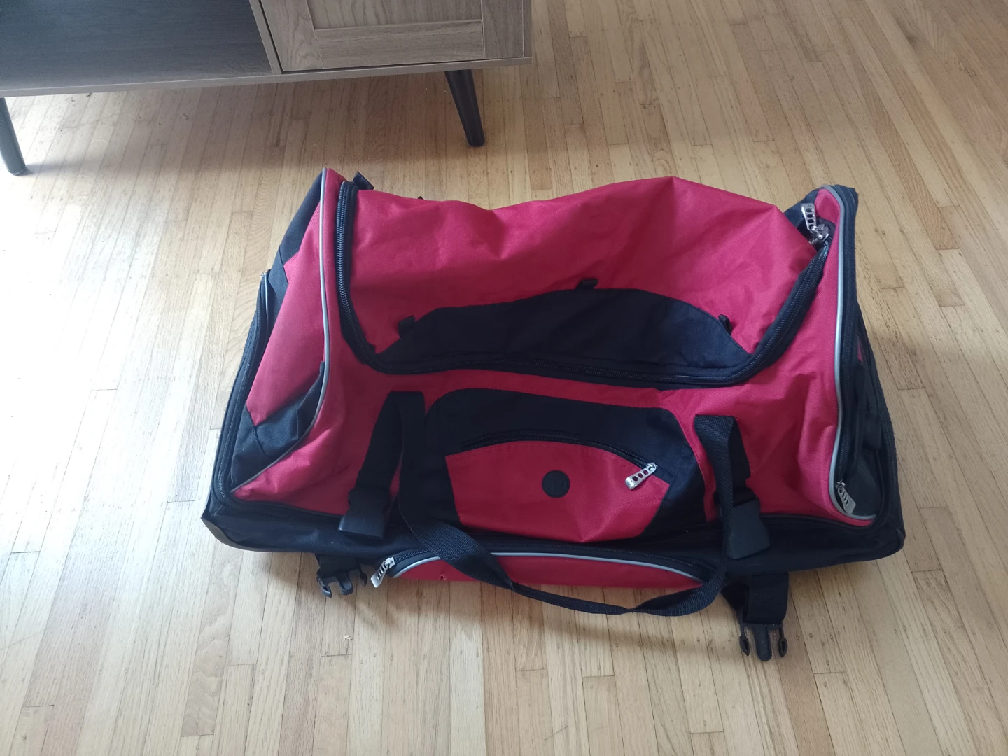 Red and Black Rolling Duffel Bag