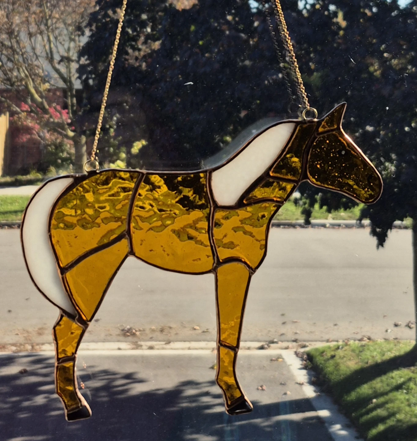 Handmade golden horse suncatcher