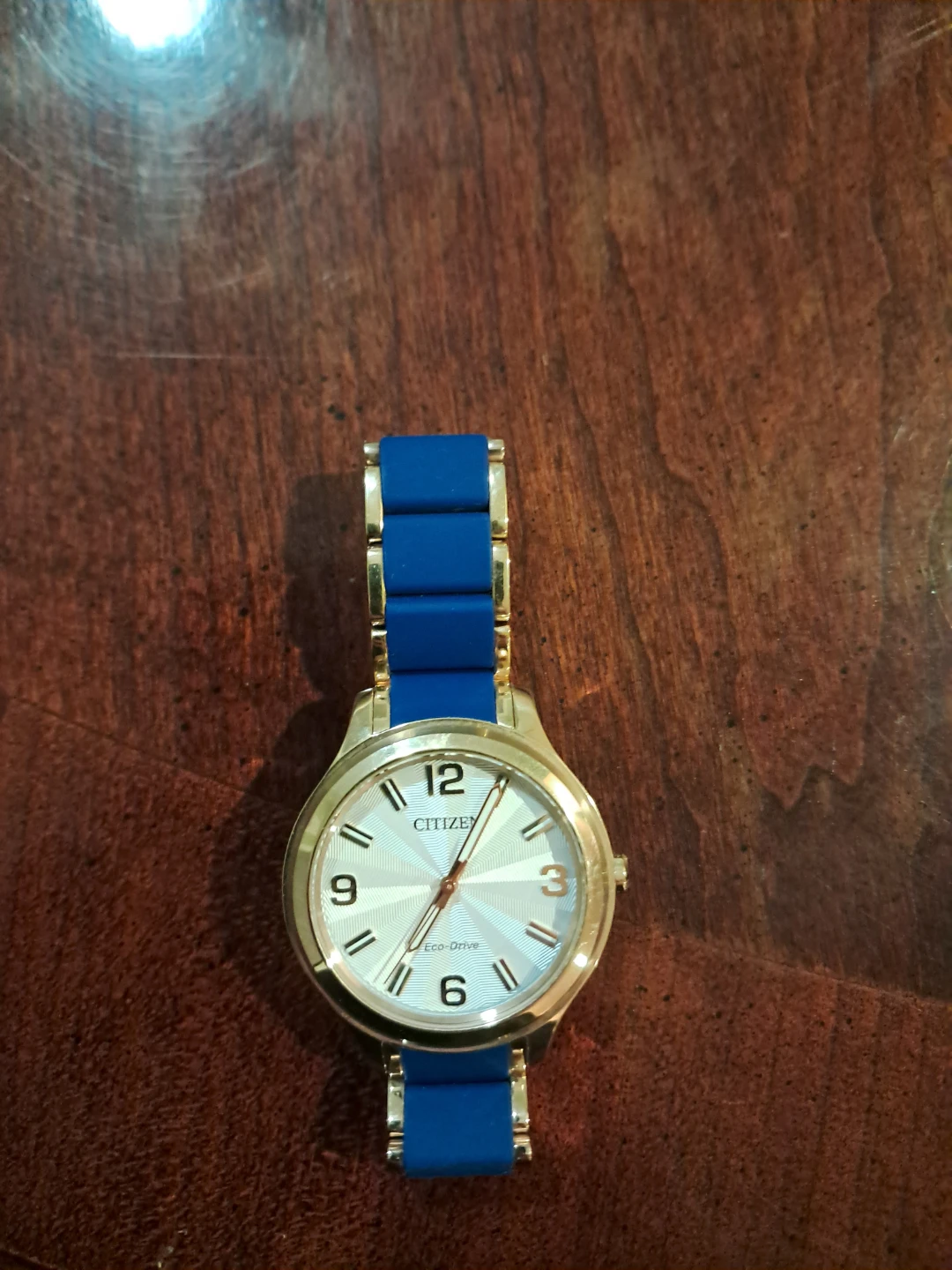 Citizen Eco Drive watch in rose gold with blue silicone bracelet
