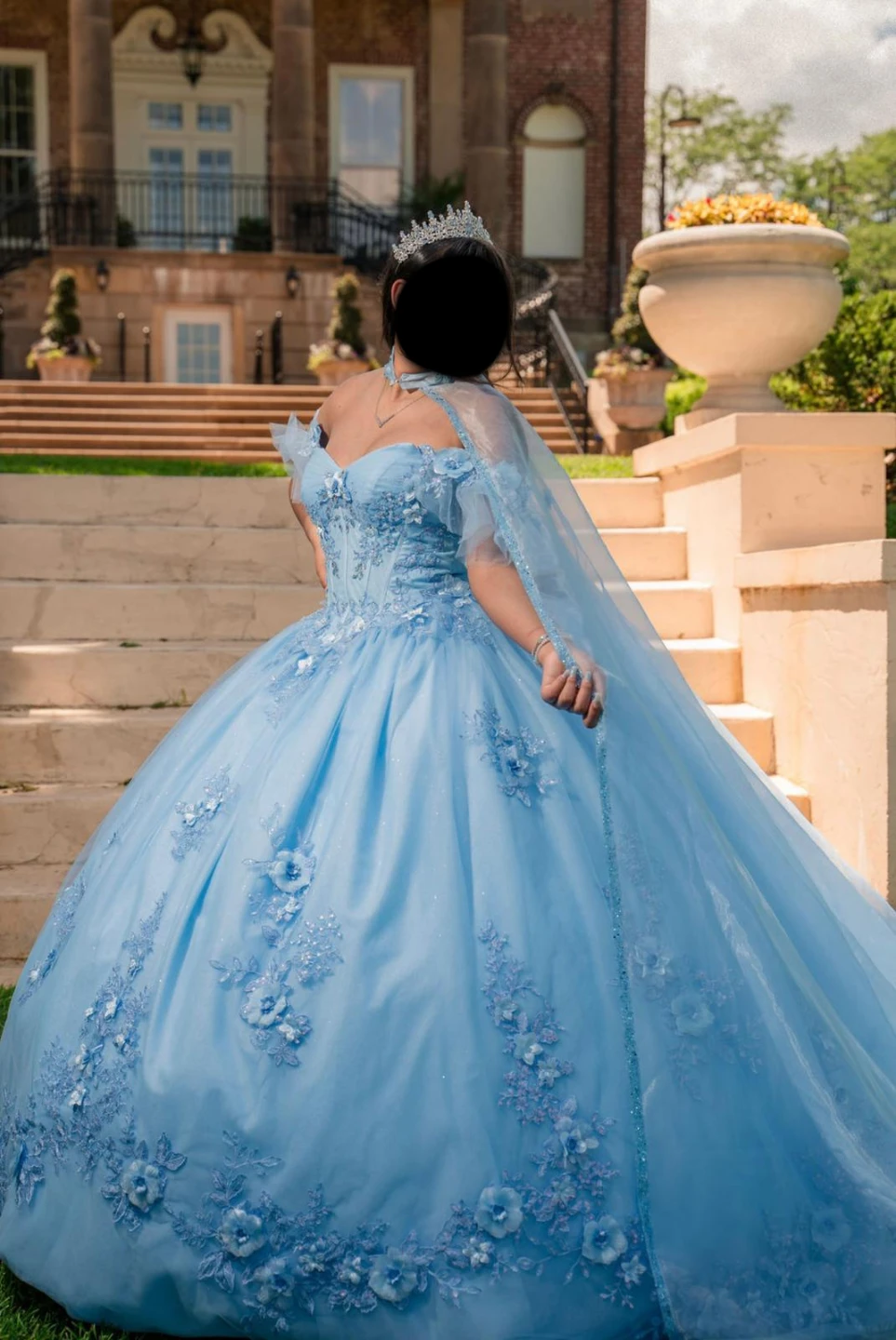 Baby blue quinceañera dress with floral touches