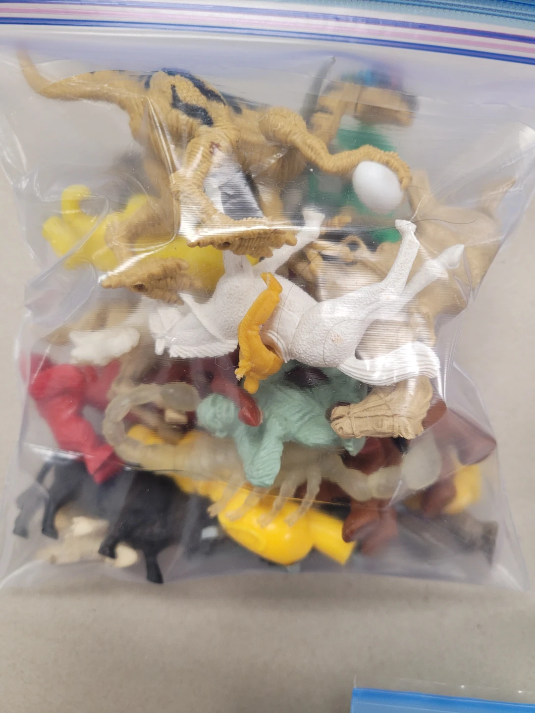 Bag of assorted toy figures and animals