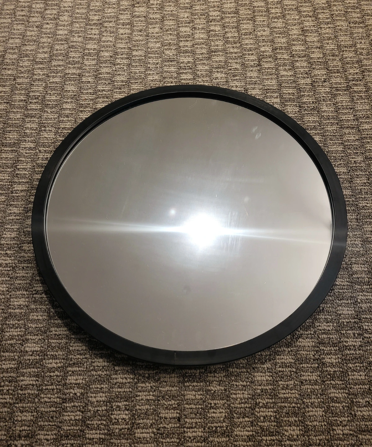 Circular black mirror
