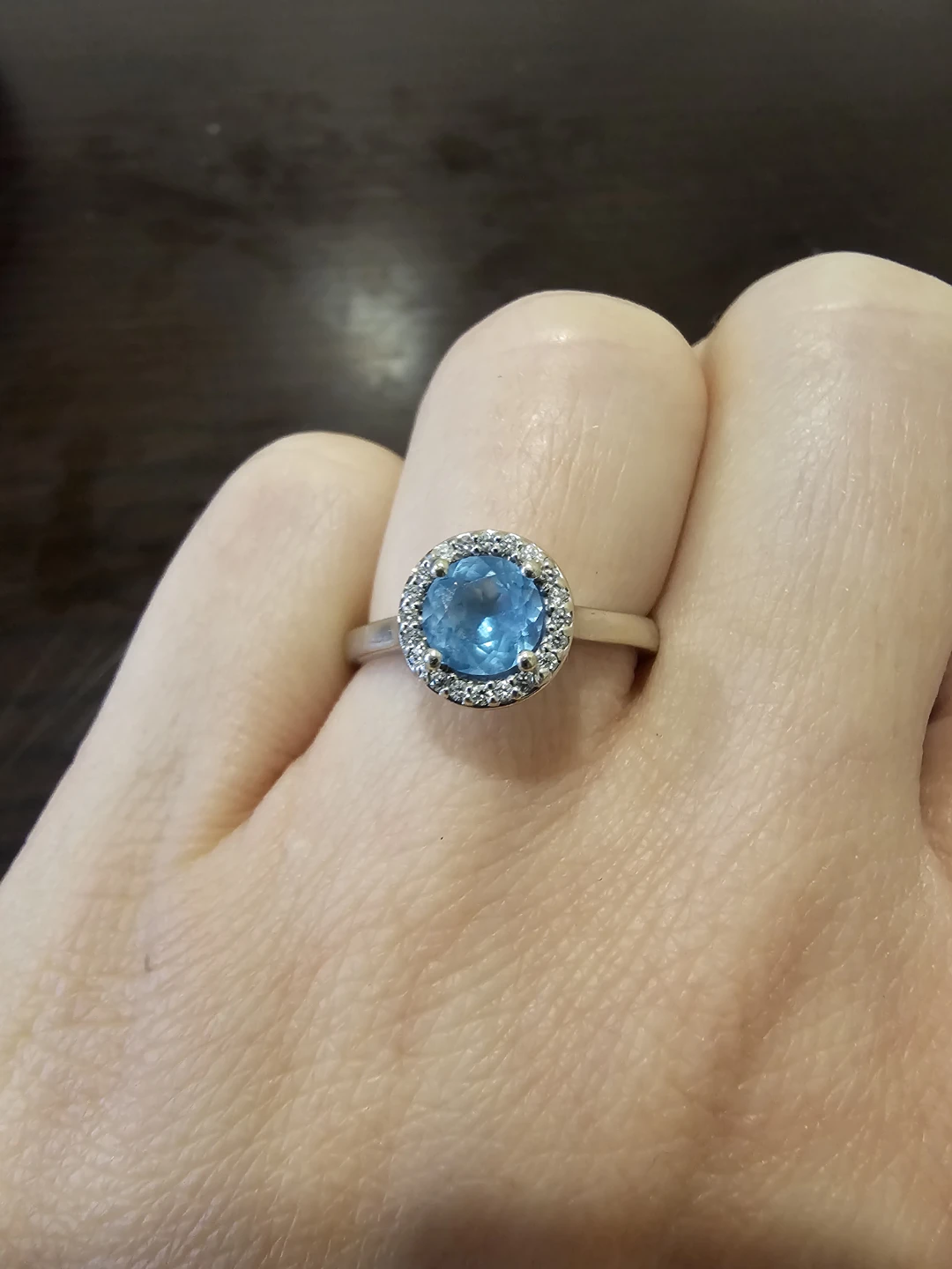 14 White gold Blue Topaz and Diamond Halo Ring