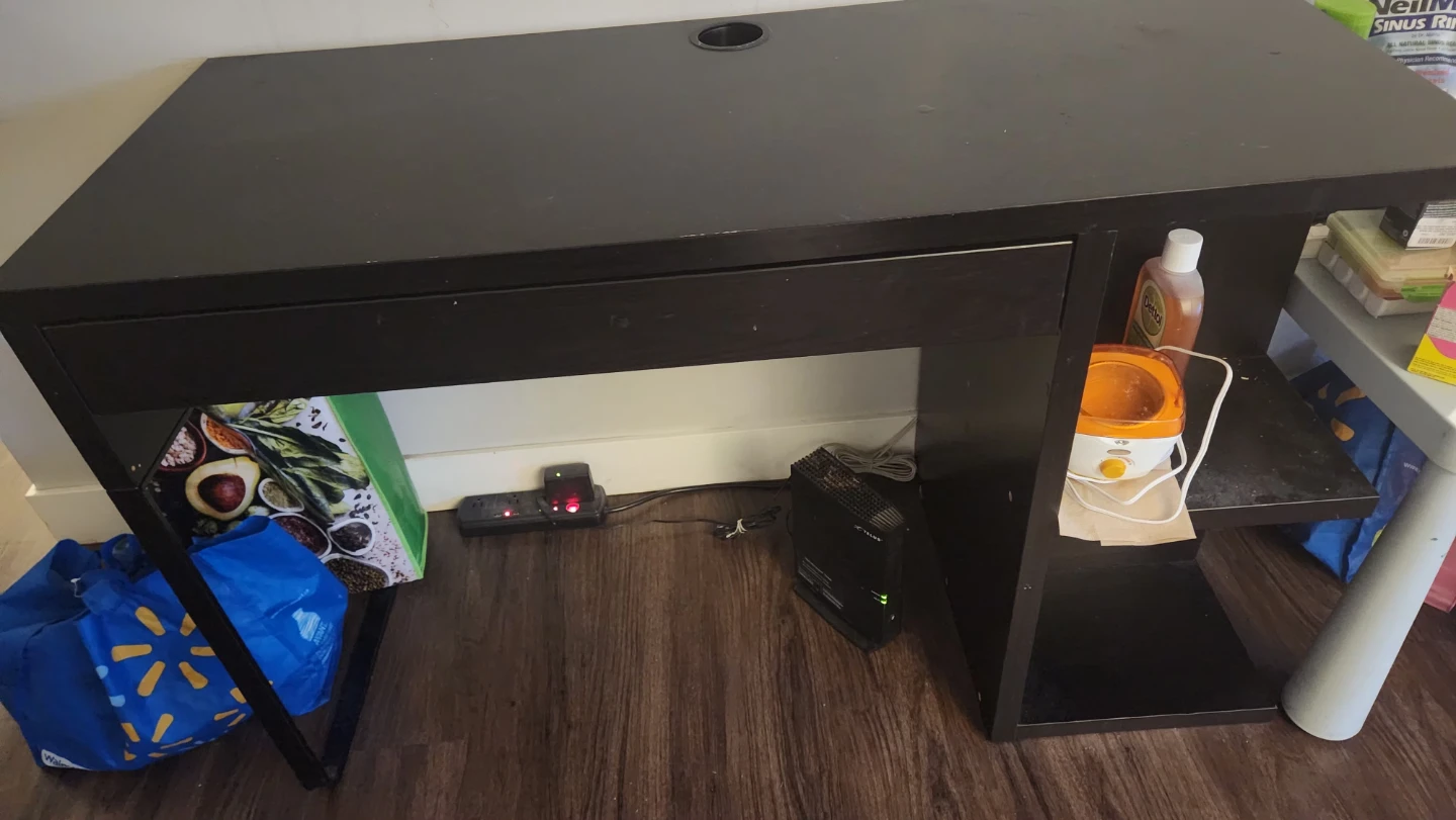 Black desk with drawer and side shelf