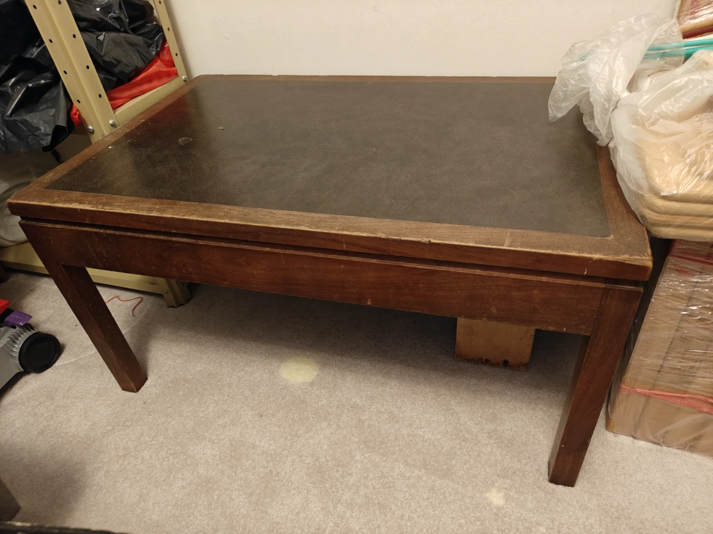 Wooden coffee table with dark inset top