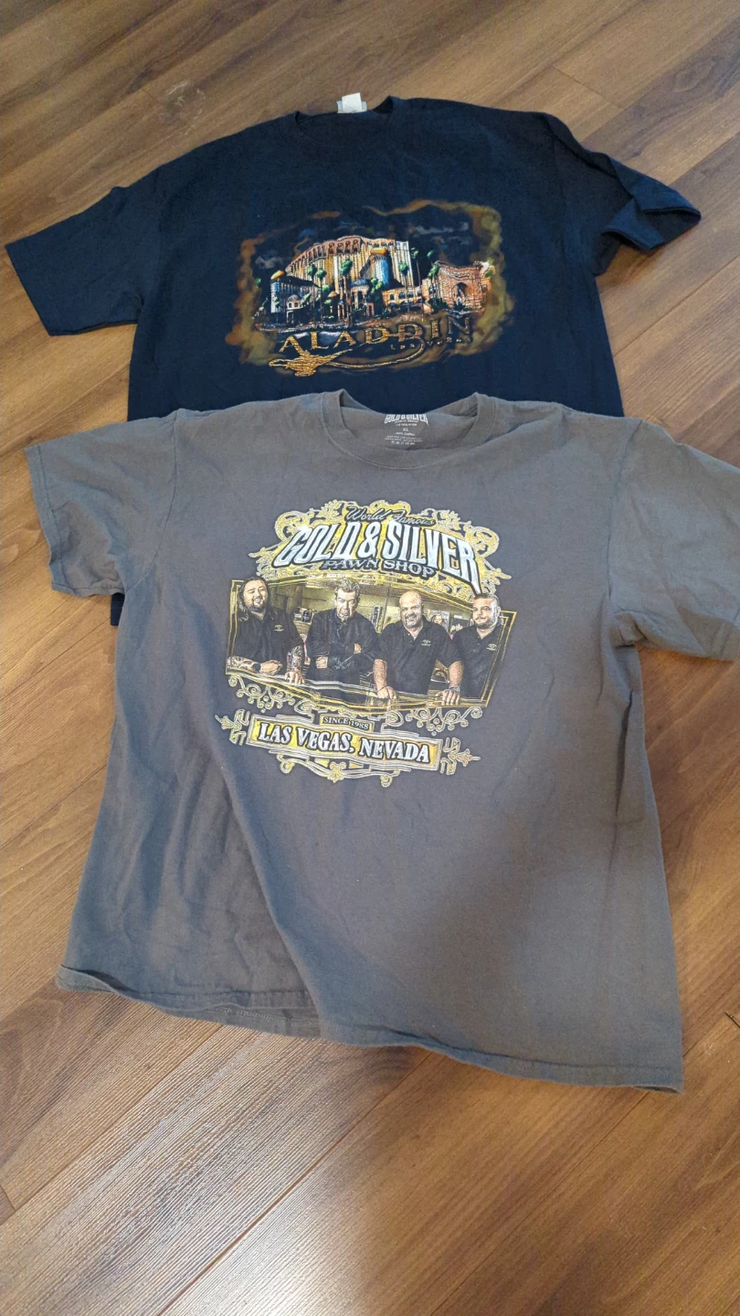 Two graphic t-shirts: Aladdin and Gold & Silver Pawn Shop XL