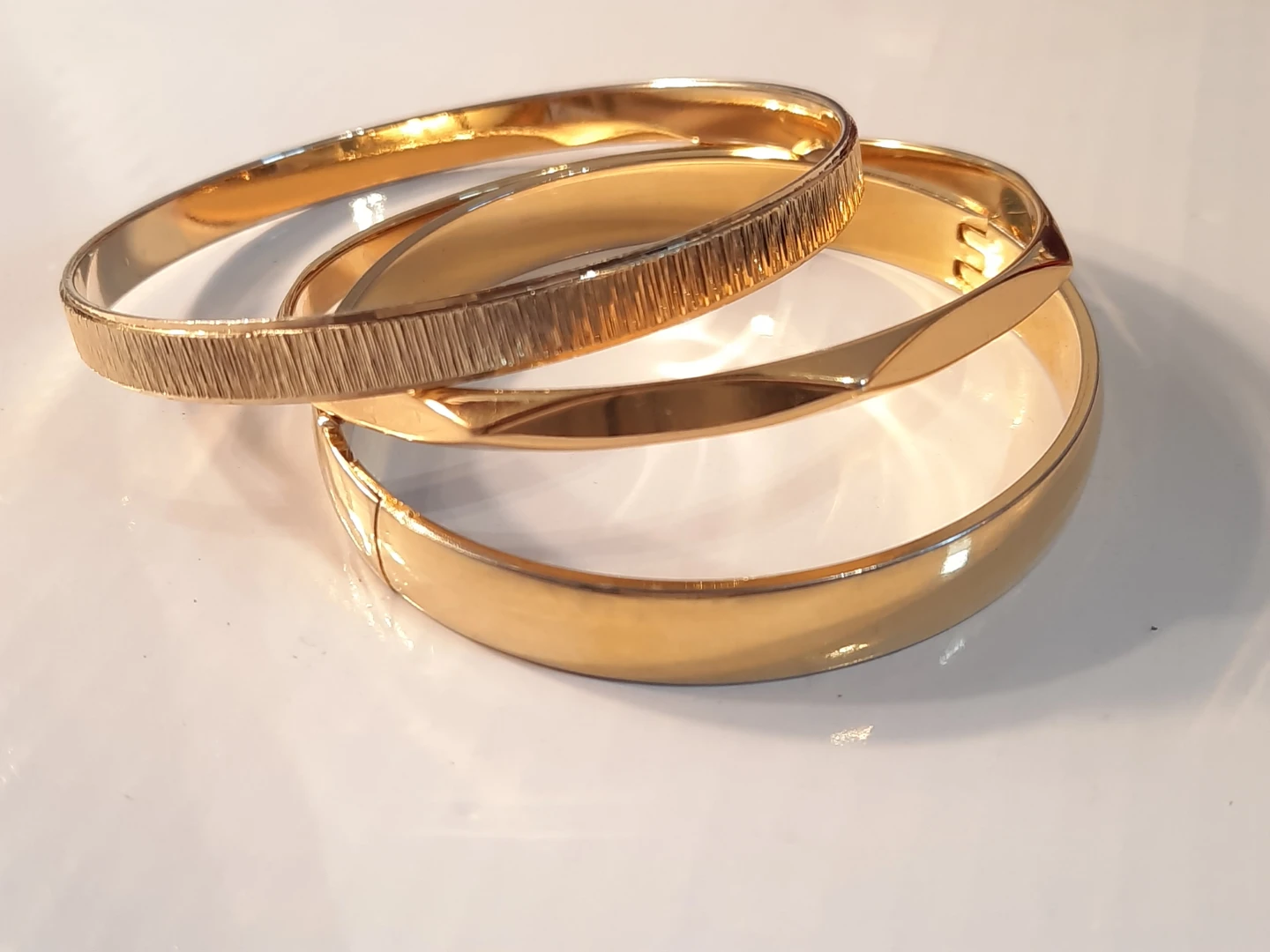 Set of 3 Gold-Tone Bangles one is Monet