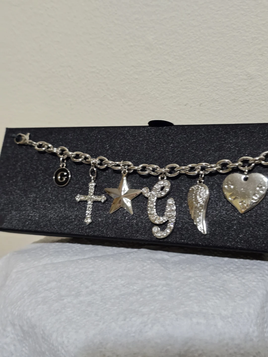 Guess Charm Bracelet with Cross, Star, G, Wing, and Heart Charms - photo 2