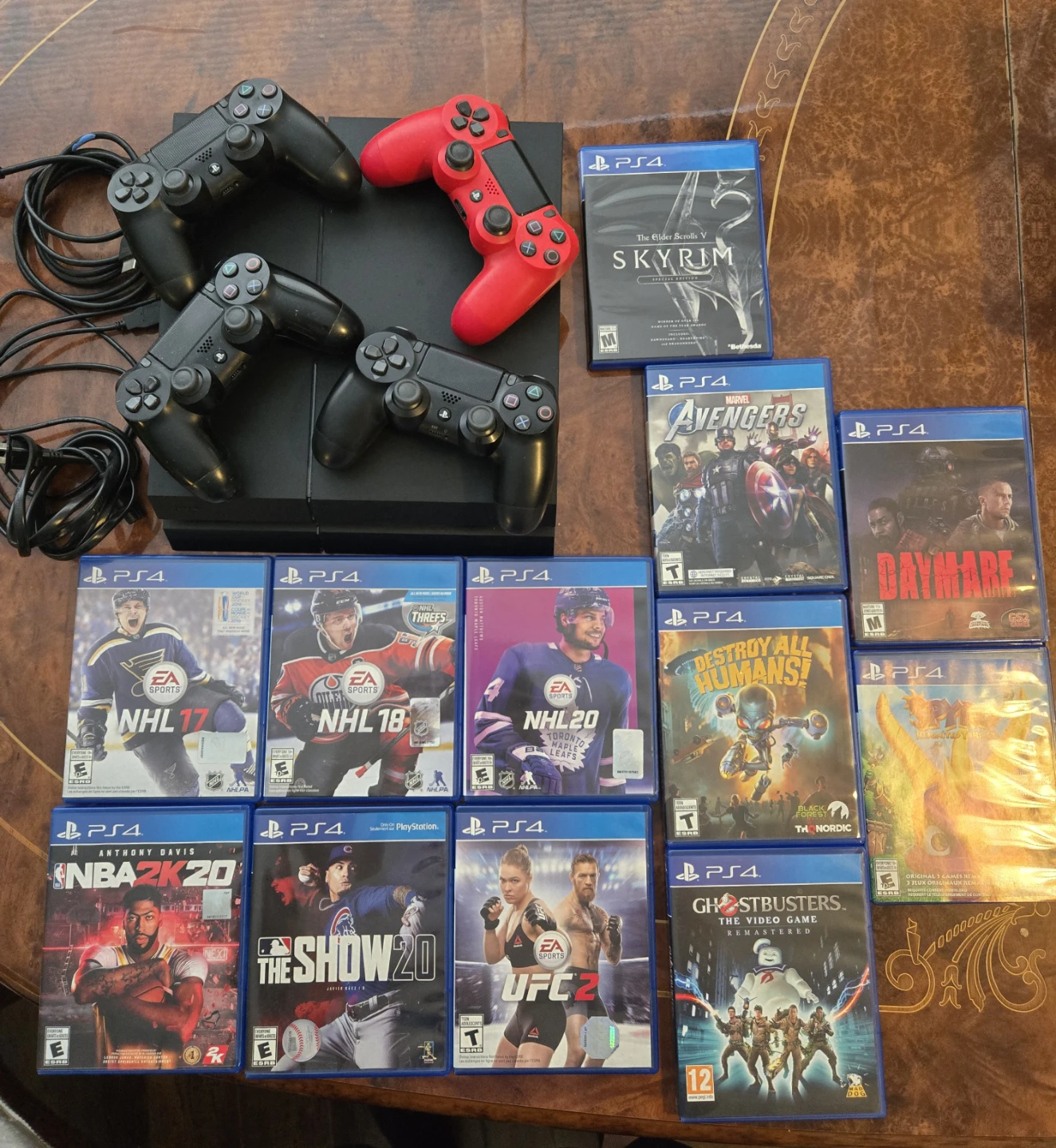 PlayStation 4 Console with 4 Controllers and 12 Games