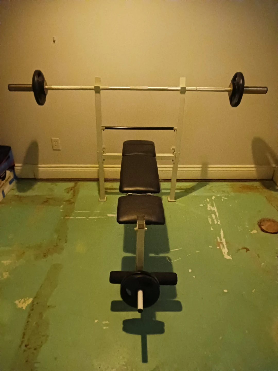 Weight Bench with Barbell and Weights