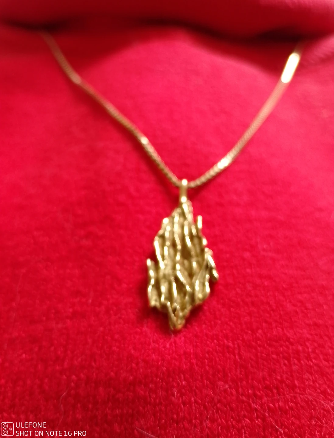 Gold necklace with unique pendant