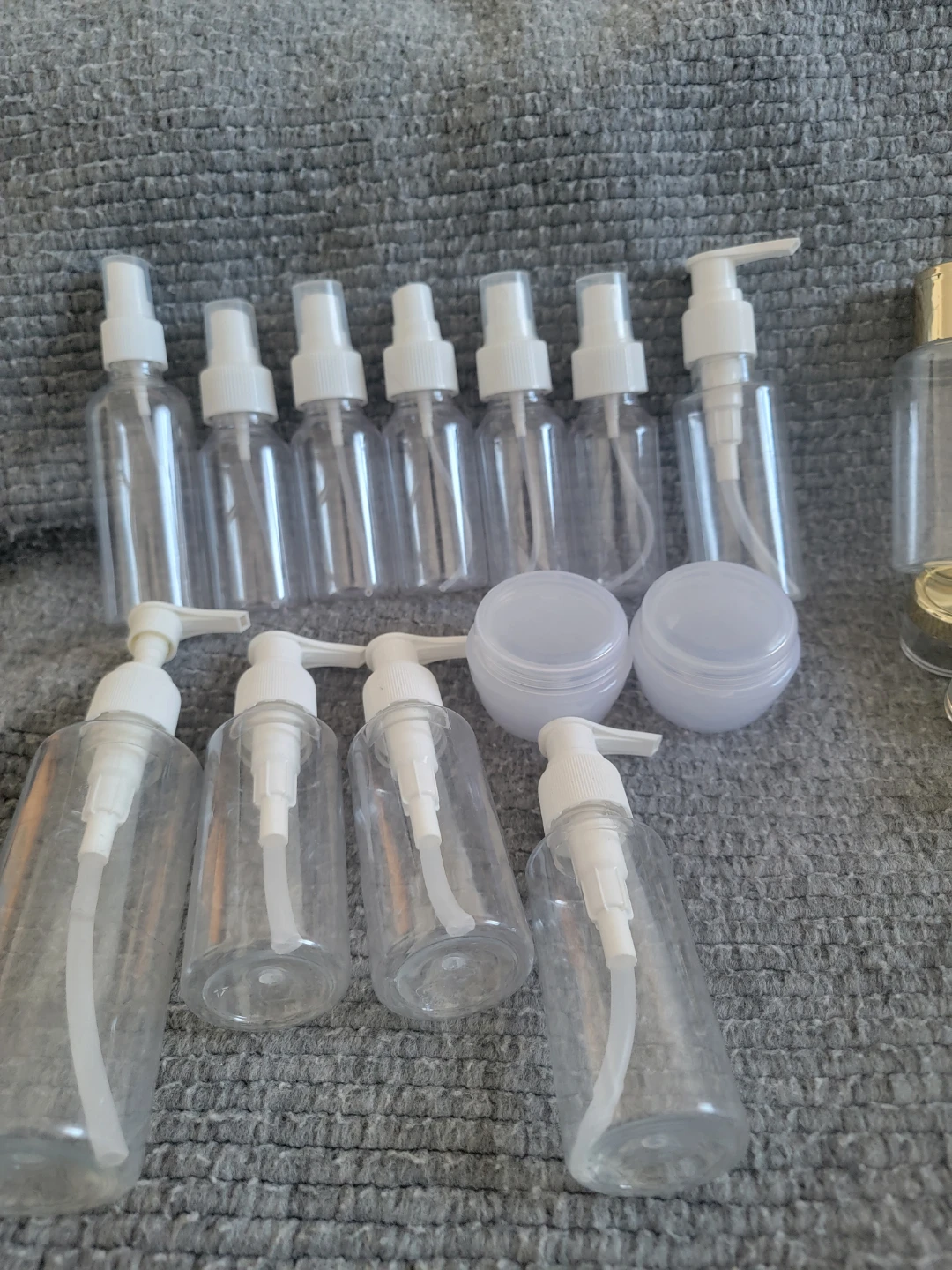 Set of 13 Clear Travel Bottles with Pumps and Sprayers