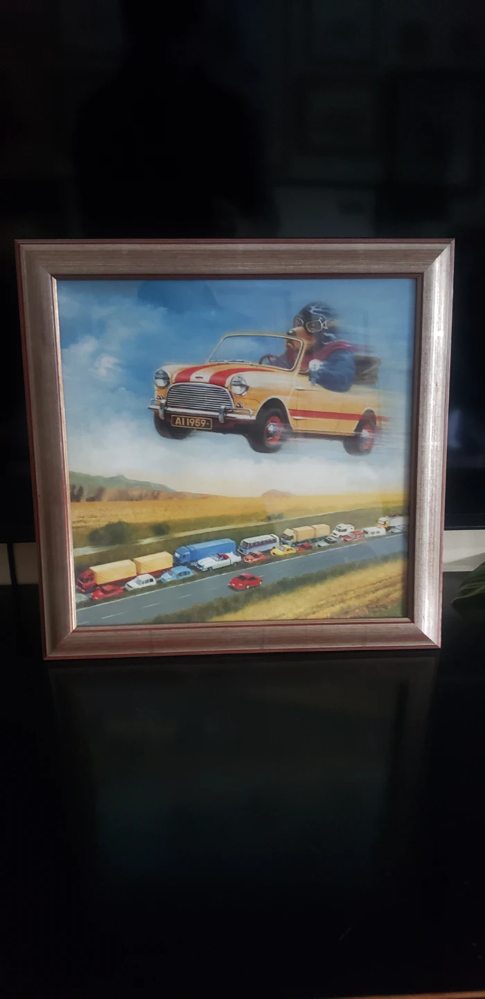 Framed Print: Mini Cooper Driving Over Traffic Jam