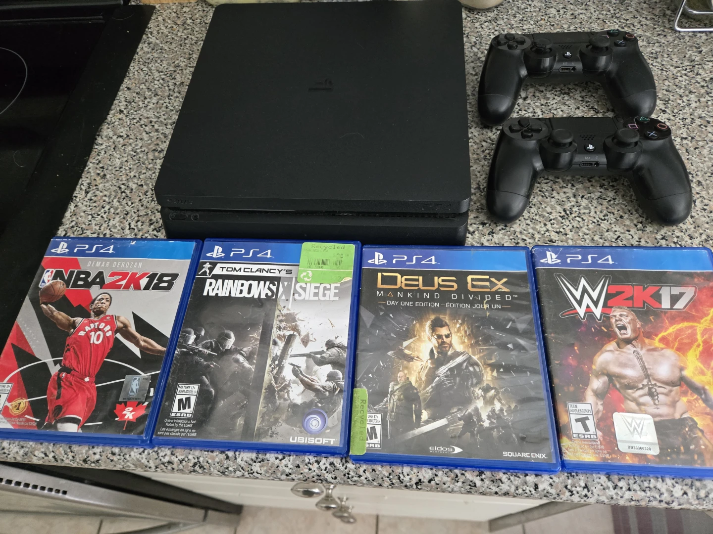 Sony PlayStation 4 Slim Console with 2 Controllers and 4 Games