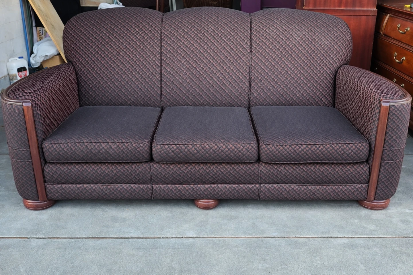 Brown patterned sofa with wood trim