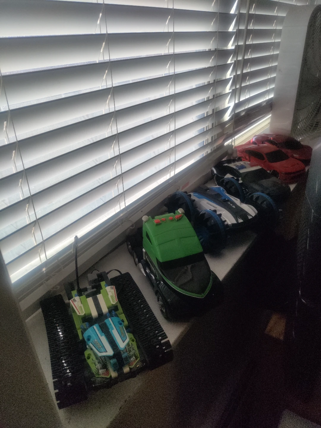 Assorted Toy Cars and Monster Trucks