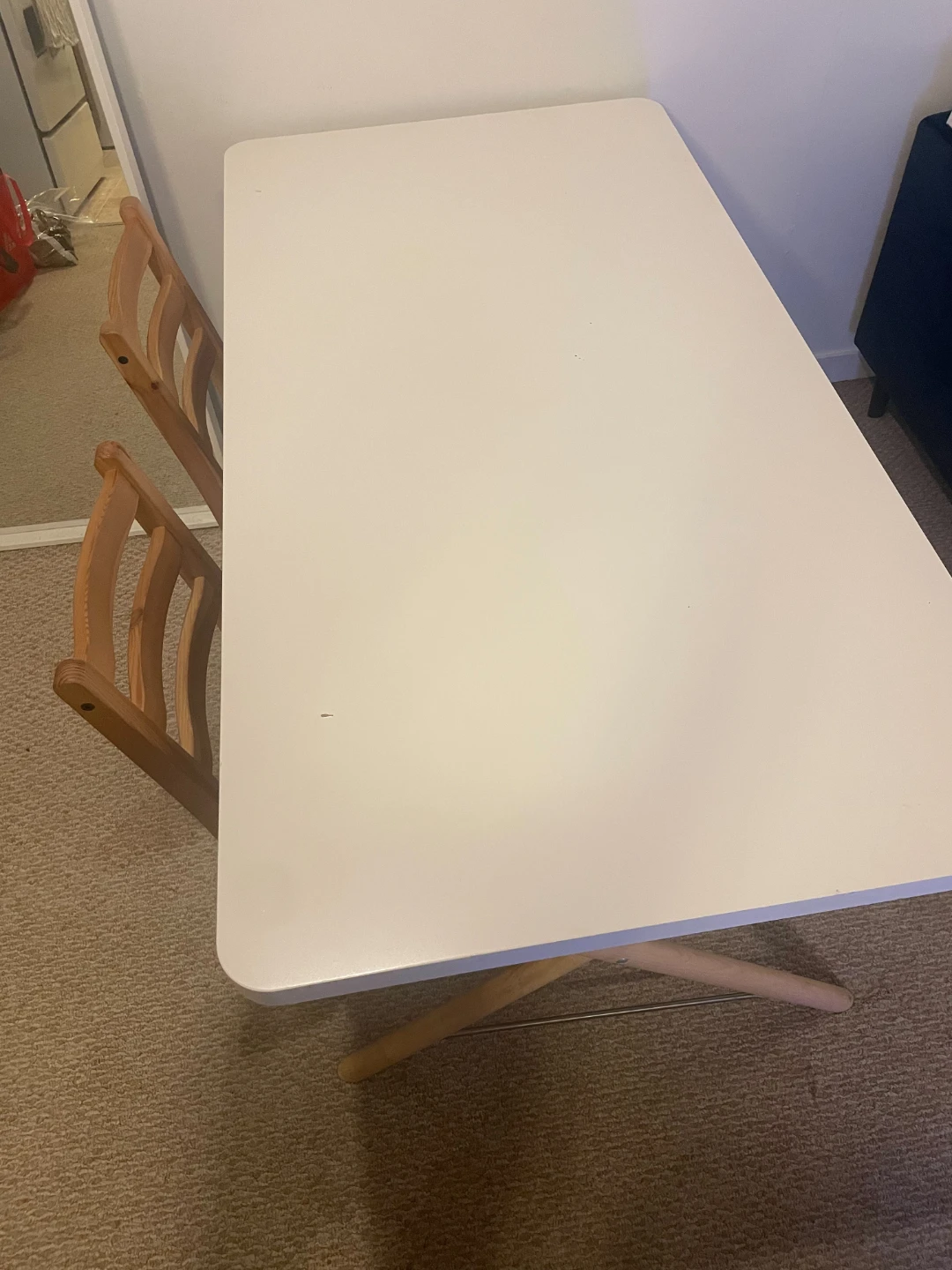 White Rectangular Dining Table with Two Wooden Chairs
