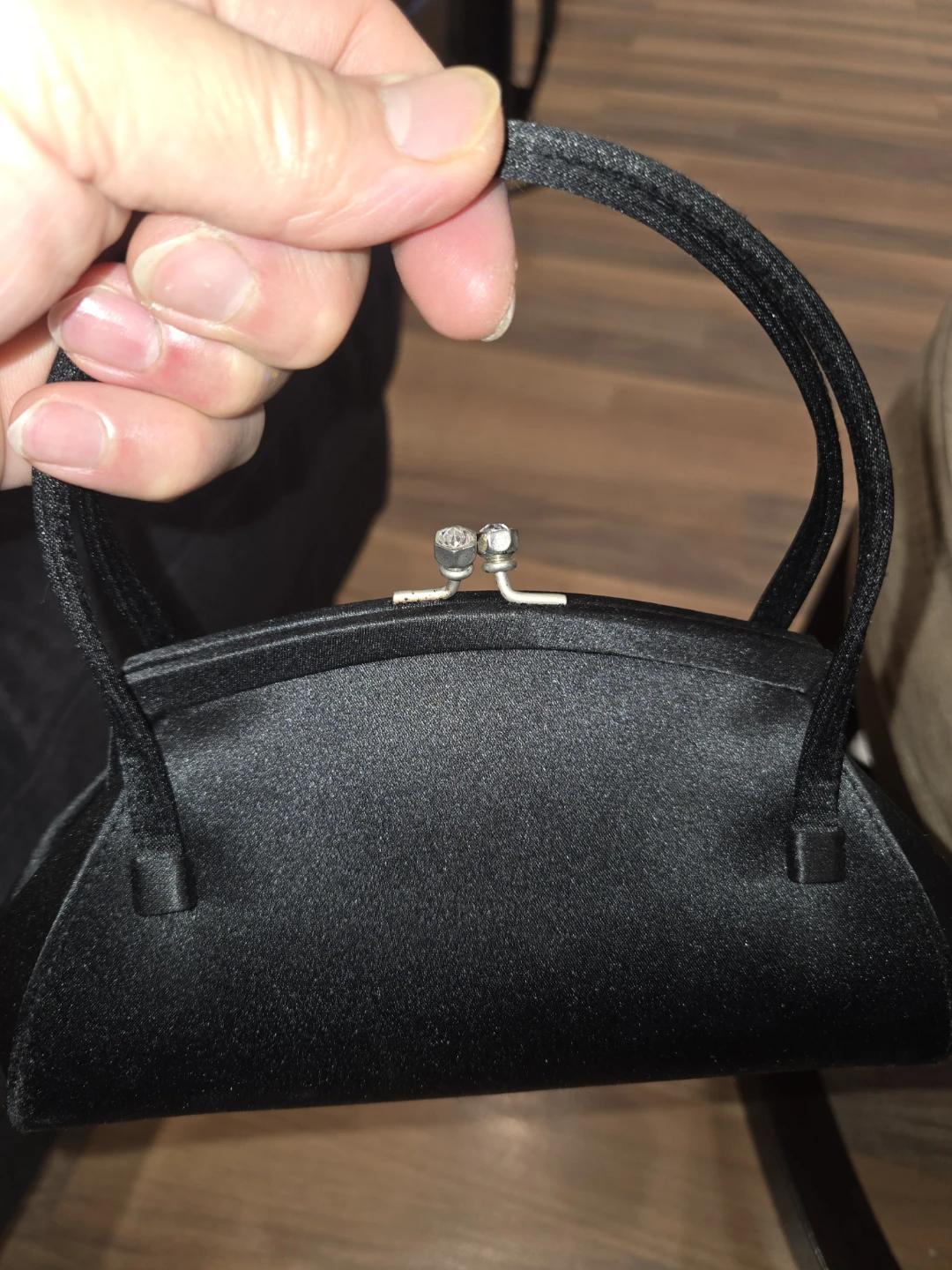 Black satin evening clutch with rhinestone clasp