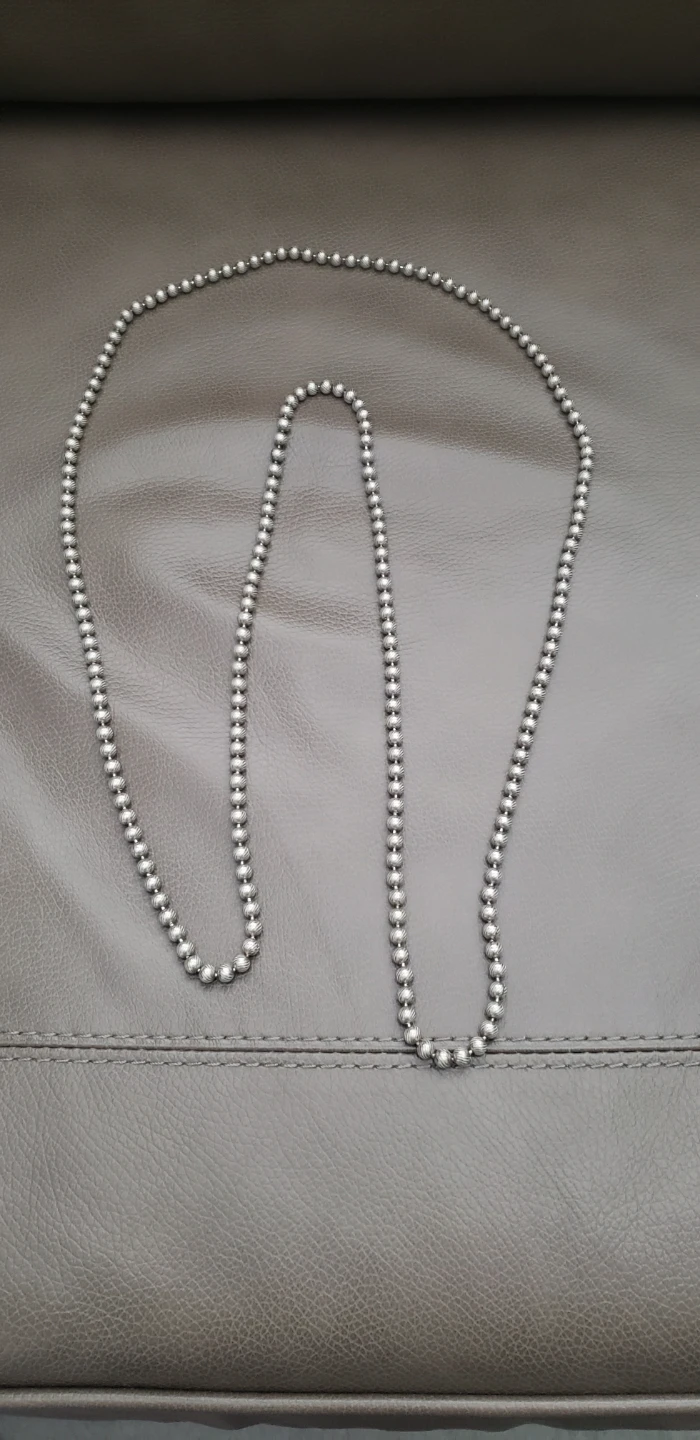 Long Necklace of Silver Tone Metal Textured Beads