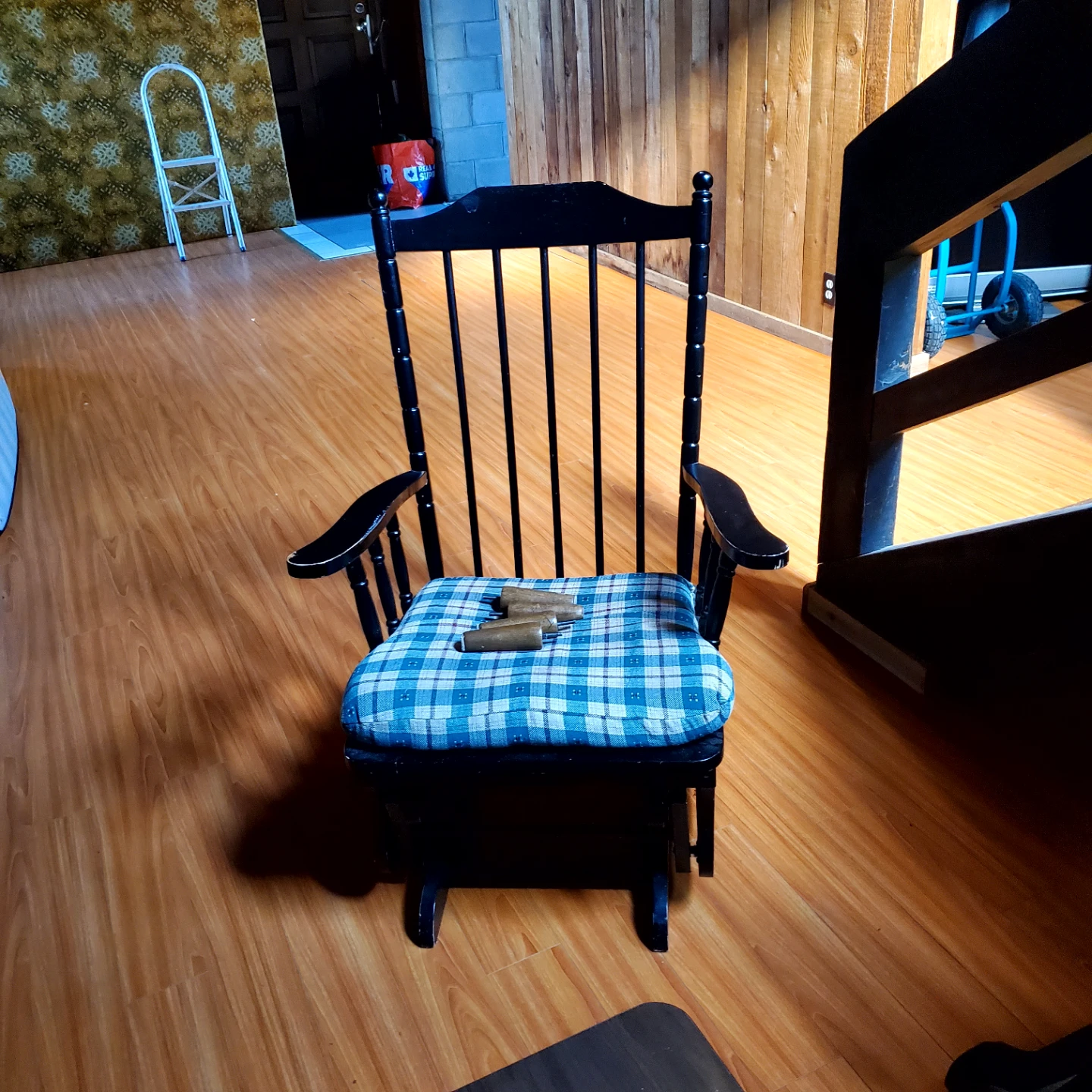 Black Rocking Chair with Plaid Cushion