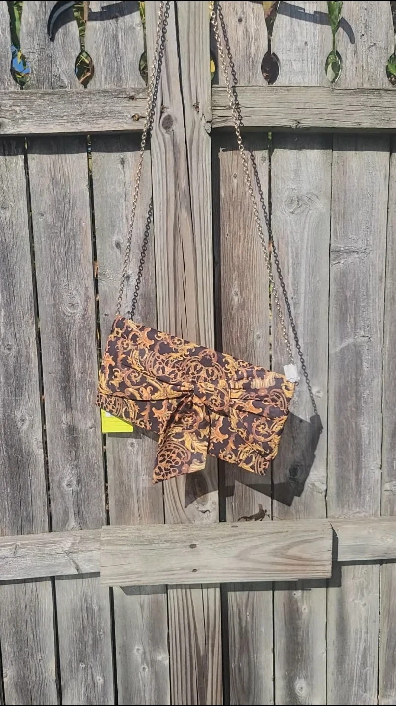 Clutch purse with ornate gold and black pattern - photo 2