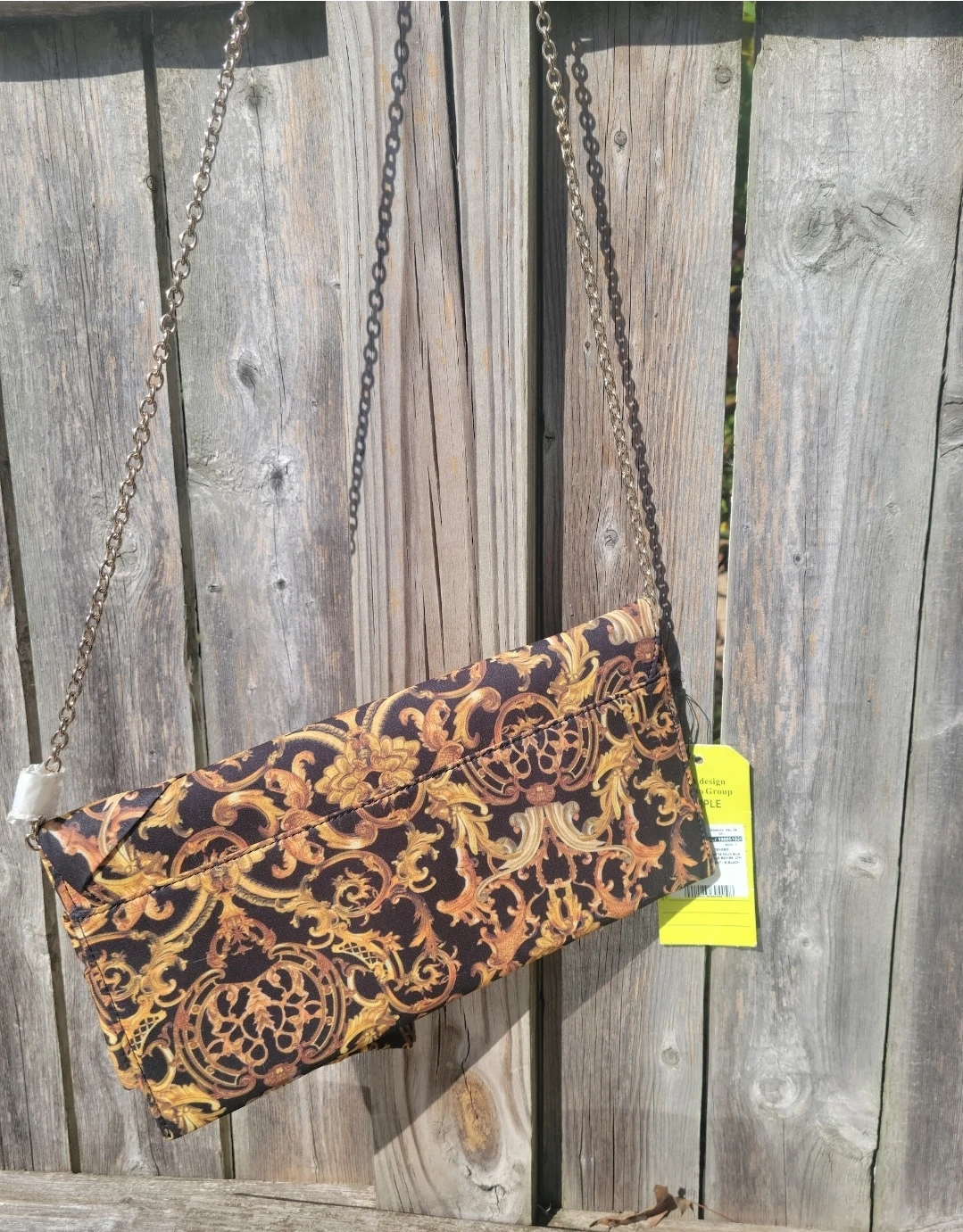 Clutch purse with ornate gold and black pattern - photo 3