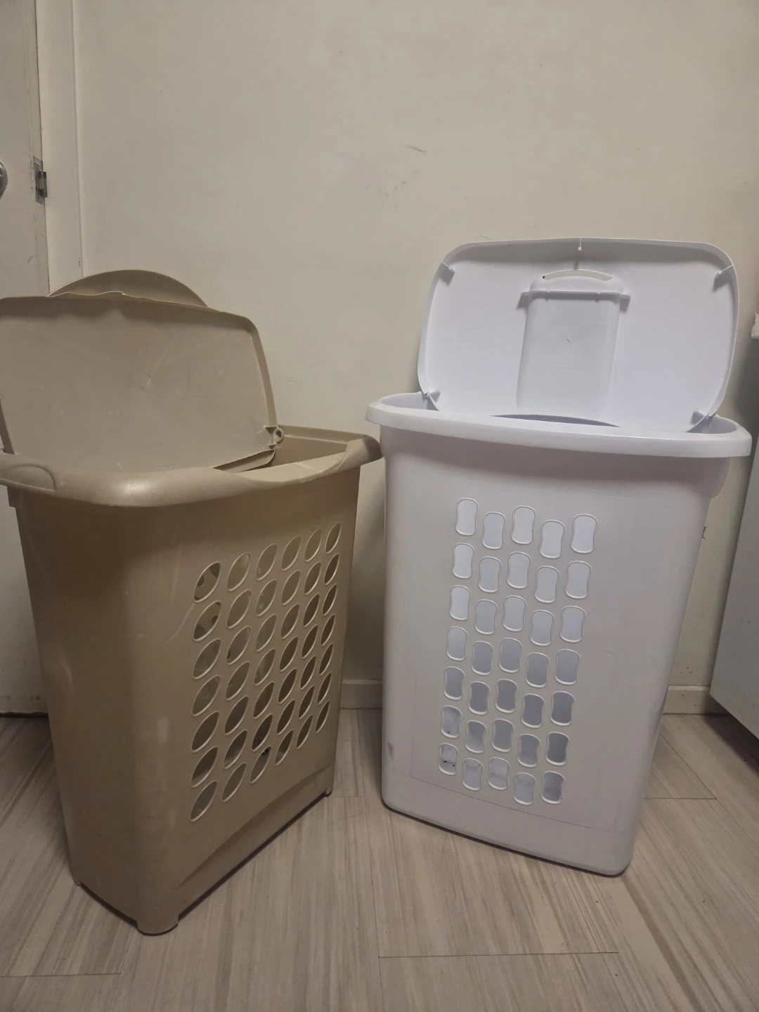 Two laundry baskets with lids