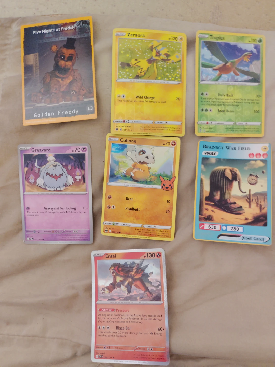 Collection of Pokemon and Five Nights at Freddy's Cards