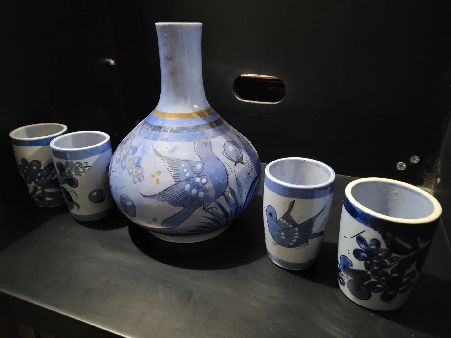Hand-painted ceramic pitcher and cup set