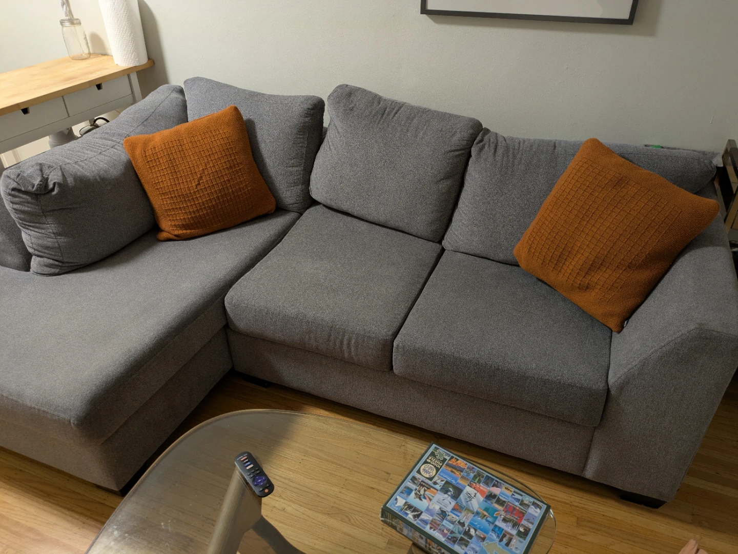 Grey Sectional Sofa with Orange Accent Pillows
