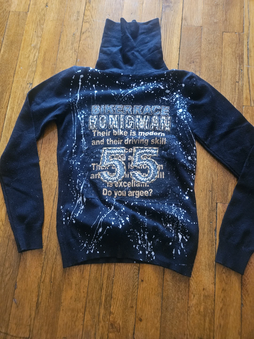 Black Turtleneck Sweater with "Bikerace Honigman 55" Graphic