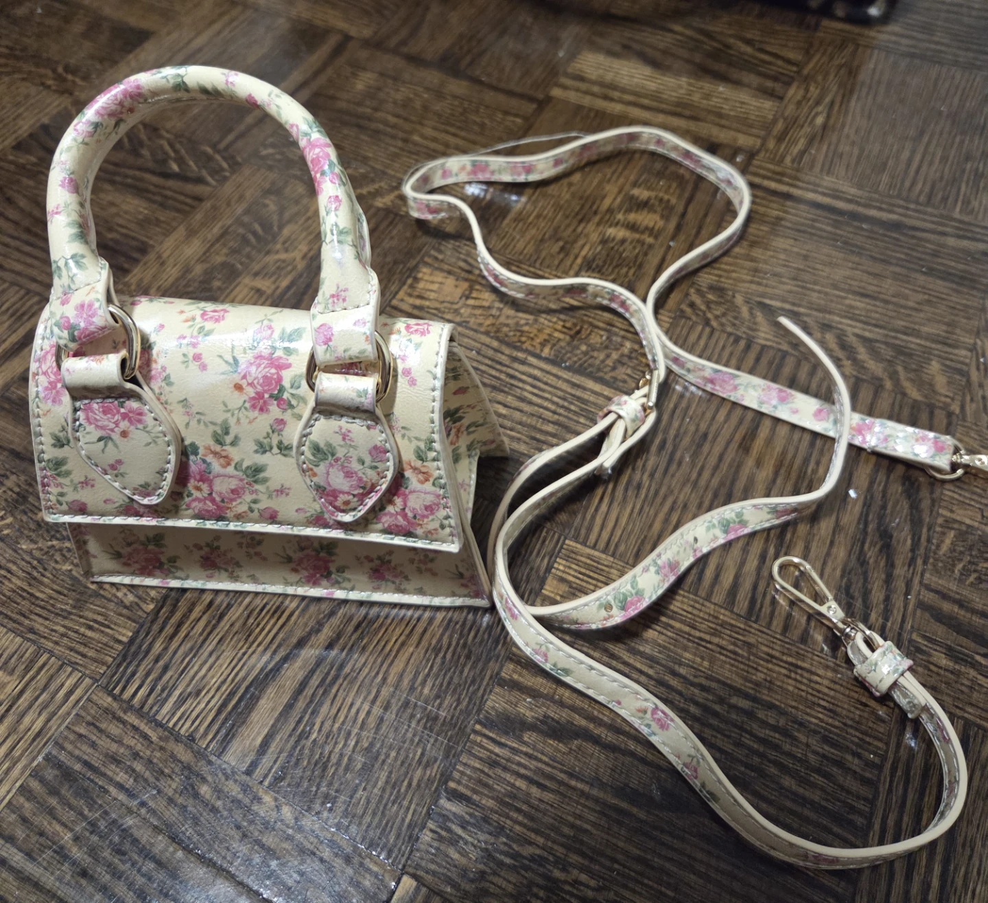 Mini handbag with floral print and adjustable strap