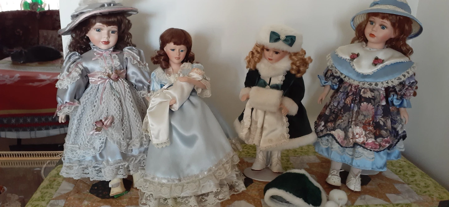 Collection of Four Porcelain Dolls