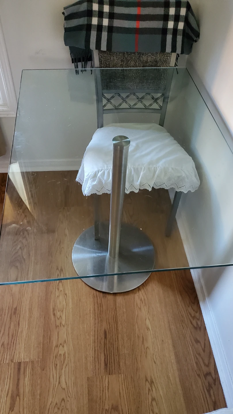 Glass top dining table with metal base