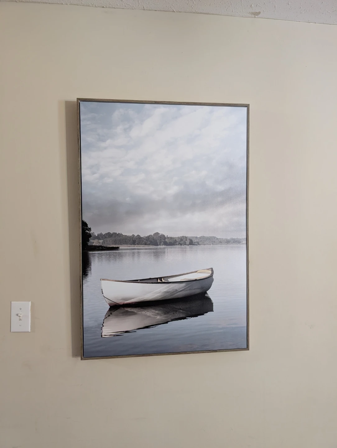 Framed Canvas Print of a Canoe on a Lake